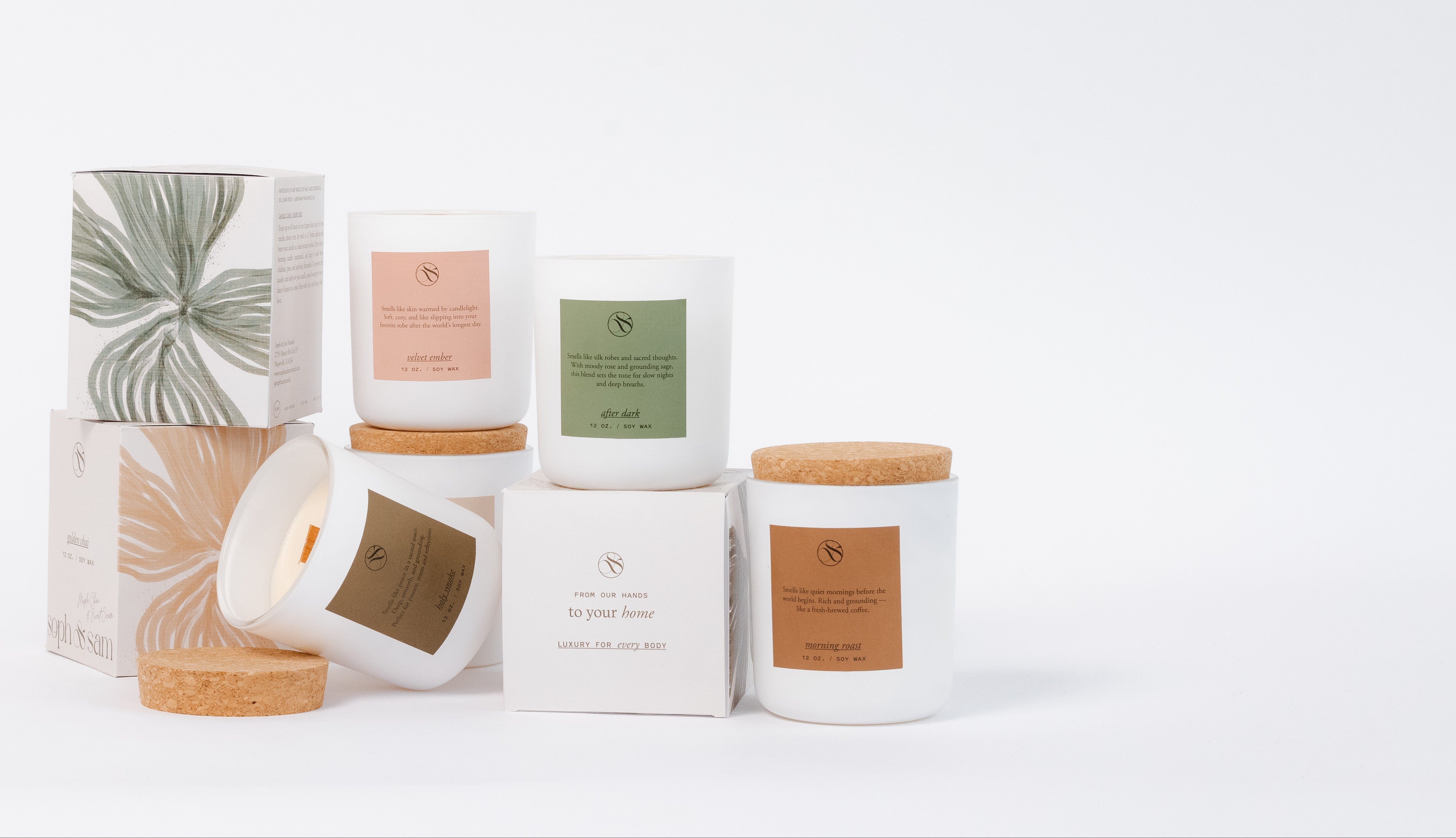 Collection of candles and boxes on a white background